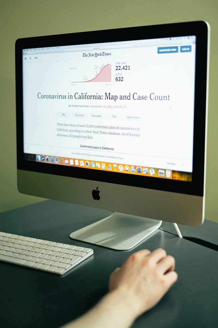 gallery-3 A computer displaying coronavirus case numbers in California on a news website.